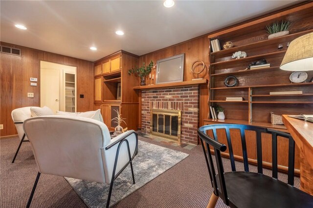 115 Crandon Way, Brighton, NY 14618 - carpeted living area with wooden walls, a brick fireplace, and recessed lighting