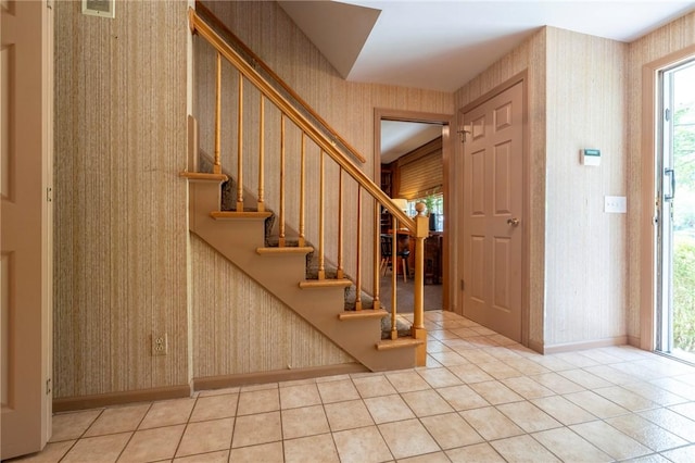 115 Crandon Way, Brighton, NY 14618 - foyer entrance with wallpapered walls, healthy amount of natural light, stairs, and tile patterned flooring