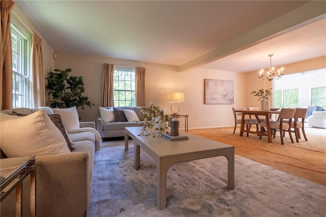 115 Crandon Way, Brighton, NY 14618 - living room with a chandelier, plenty of natural light, light wood finished floors, and beamed ceiling
