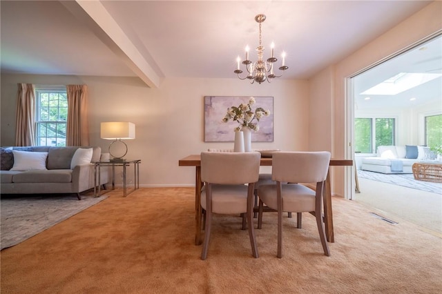 115 Crandon Way, Brighton, NY 14618 - dining area featuring light carpet, a chandelier, and beam ceiling