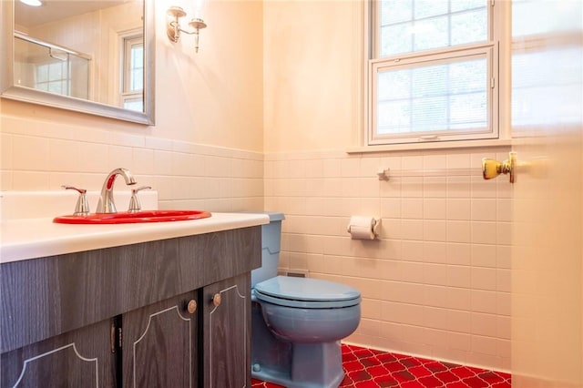 115 Crandon Way, Brighton, NY 14618 - bathroom with vanity, tile walls, wainscoting, and a shower with shower door