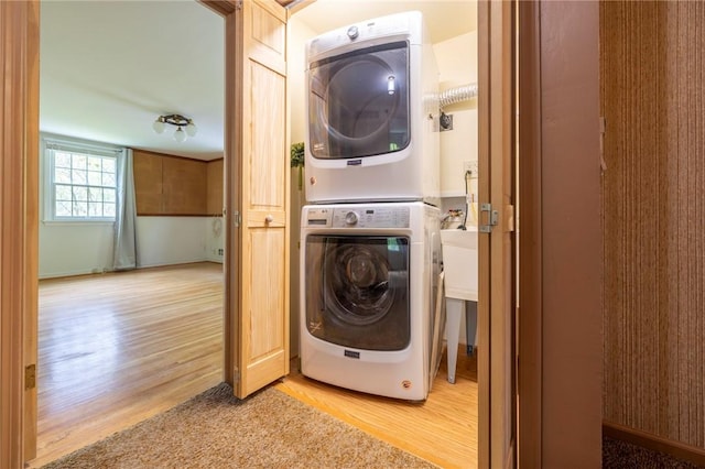 115 Crandon Way, Brighton, NY 14618 - laundry area with stacked washer and clothes dryer and light wood-style floors