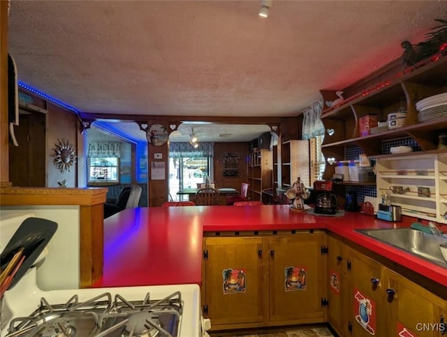 2008 Main St, Vienna, NY 13157 - kitchen featuring white gas range, open shelves, and a textured ceiling