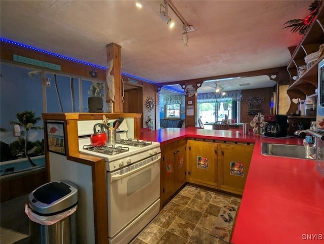 2008 Main St, Vienna, NY 13157 - kitchen featuring white range with gas stovetop and a sink
