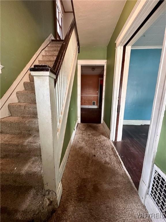 524 10th St, Niagara Falls, NY 14301 - staircase featuring baseboards