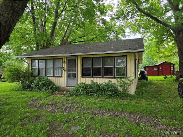 911 Shoreham St, Carlton, NY 14571 - view of front of property with board and batten siding and a chimney