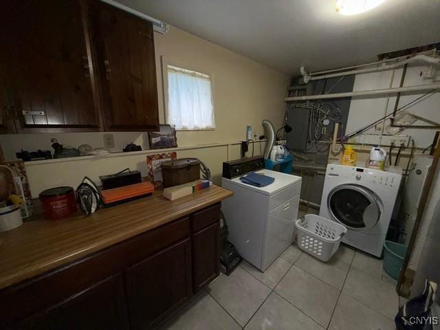 27217 Three Mile Point Rd, Lyme, NY 13622 - laundry area with washer and clothes dryer and light tile patterned floors