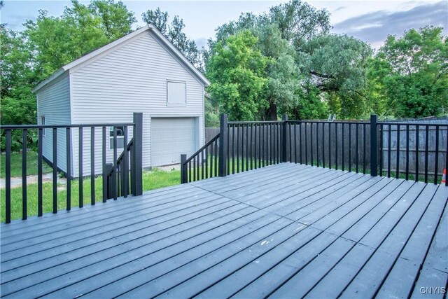 8430 Willow St, Le Ray, NY 13637 - wooden deck featuring an outbuilding, view of wooded area, and driveway