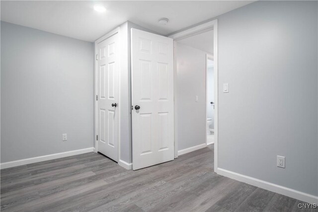 8430 Willow St, Le Ray, NY 13637 - unfurnished bedroom with wood finished floors and recessed lighting