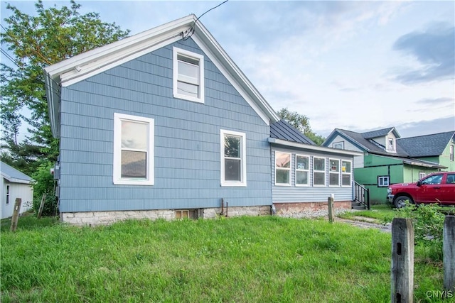 8430 Willow St, Le Ray, NY 13637 - view of side of home with a yard