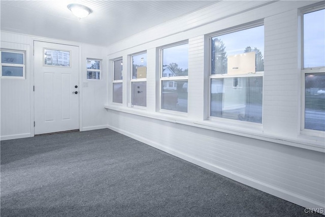 8430 Willow St, Le Ray, NY 13637 - foyer entrance featuring dark carpet and healthy amount of natural light