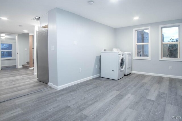 8430 Willow St, Le Ray, NY 13637 - laundry area featuring washer and clothes dryer and wood finished floors