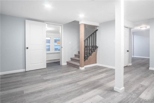 8430 Willow St, Le Ray, NY 13637 - below grade area featuring stairs and wood finished floors