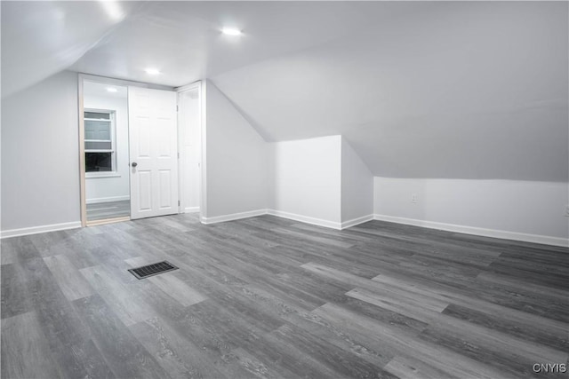 8430 Willow St, Le Ray, NY 13637 - bonus room with lofted ceiling and dark wood-style flooring