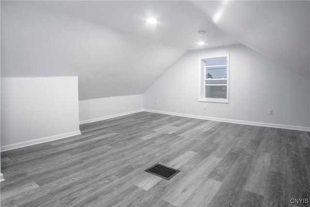 8430 Willow St, Le Ray, NY 13637 - bonus room with dark wood-style floors and vaulted ceiling