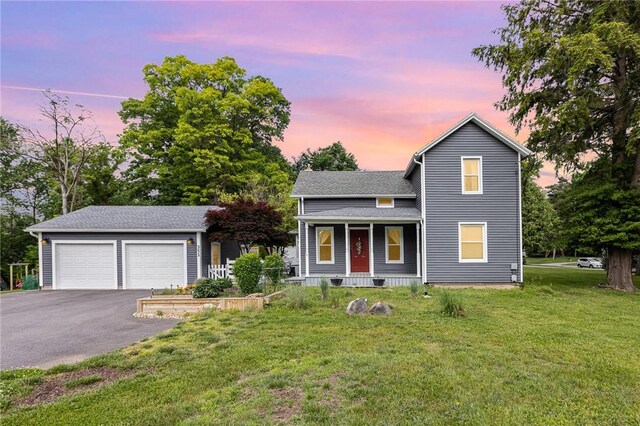 351 Jefferson Ave, Perinton, NY 14450 - traditional-style house featuring a porch, asphalt driveway, a front lawn, and roof with shingles
