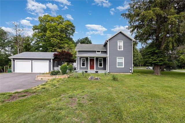351 Jefferson Ave, Perinton, NY 14450 - traditional-style house with a garage, covered porch, a front lawn, and asphalt driveway