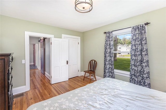 351 Jefferson Ave, Perinton, NY 14450 - bedroom featuring wood finished floors and baseboards