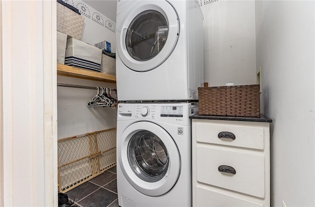 351 Jefferson Ave, Perinton, NY 14450 - laundry room featuring stacked washing machine and dryer and dark tile patterned floors
