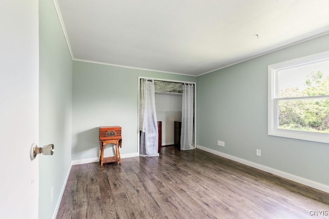 7118 Glass Factory Rd, Trenton, NY 13354 - unfurnished bedroom with wood finished floors, crown molding, and a closet