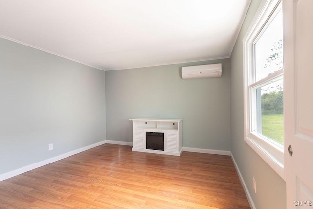 7118 Glass Factory Rd, Trenton, NY 13354 - unfurnished living room featuring an AC wall unit, light wood finished floors, a fireplace, and ornamental molding