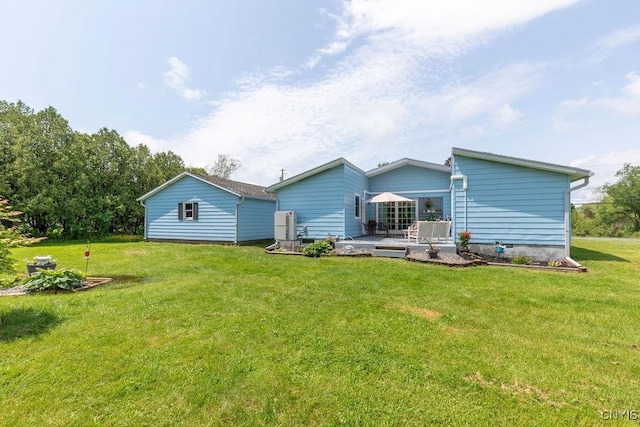 7118 Glass Factory Rd, Trenton, NY 13354 - rear view of house with a lawn and a patio