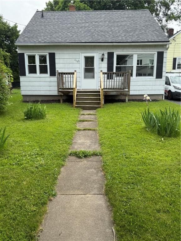 202 Klein St, Rochester, NY 14621 - bungalow-style house featuring a shingled roof, a front lawn, a chimney, and a deck
