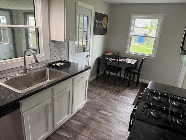 202 Klein St, Rochester, NY 14621 - kitchen featuring dishwasher, black gas range oven, backsplash, dark wood finished floors, and white cabinetry