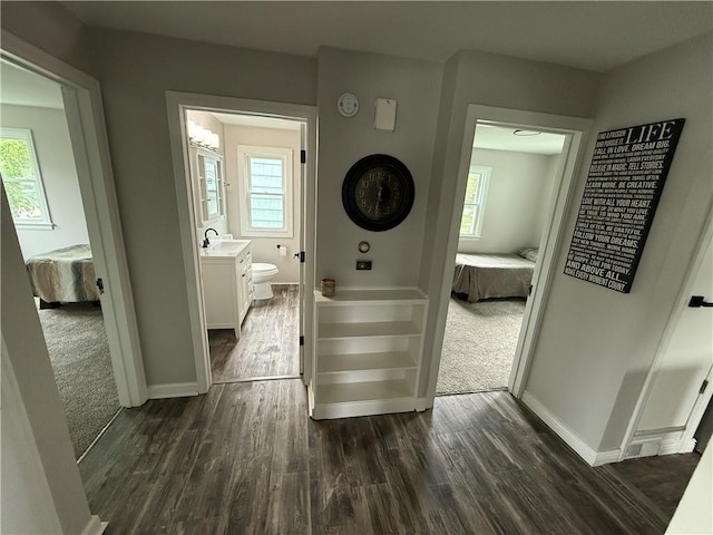 202 Klein St, Rochester, NY 14621 - laundry room with dark wood-style floors and healthy amount of natural light