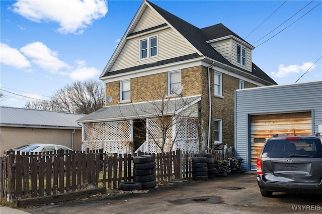 2320 Niagara St, Niagara Falls, NY 14303 - view of front of home featuring brick siding, a garage, and driveway