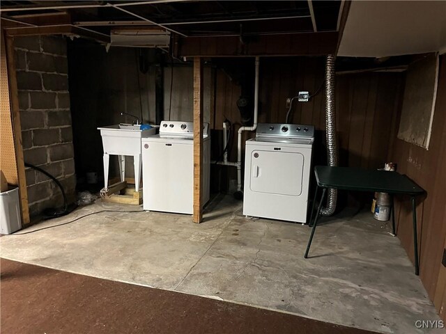 19 Genesee Ct Unit 19, Utica, NY 13502 - unfinished below grade area with washing machine and clothes dryer and a sink