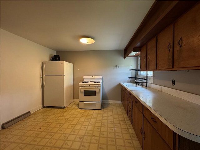 28 Mckune Ave, Foster-Town, PA 16701 - kitchen with white appliances, a baseboard radiator, light flooring, and light countertops