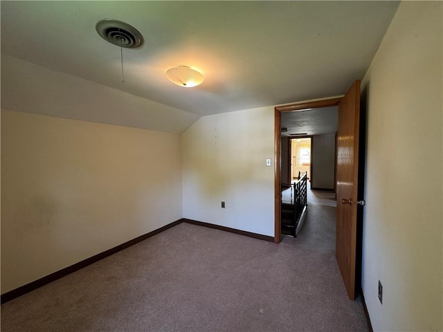 28 Mckune Ave, Foster-Town, PA 16701 - empty room featuring dark carpet and lofted ceiling