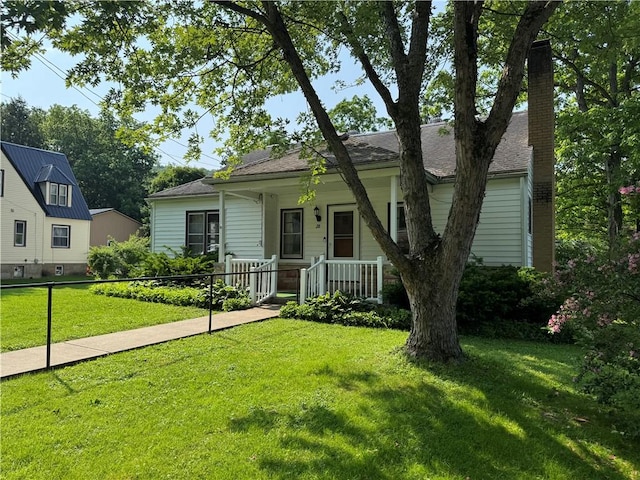 28 Mckune Ave, Foster-Town, PA 16701 - bungalow-style house with a porch, a chimney, and roof with shingles