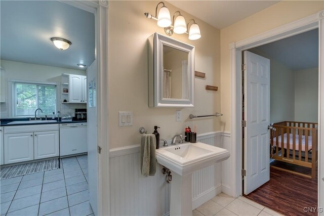 29647 Burnup Rd, Rutland, NY 13612 - full bathroom featuring a wainscoted wall and tile patterned floors