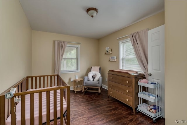 29647 Burnup Rd, Rutland, NY 13612 - bedroom featuring dark wood-style floors and a nursery area