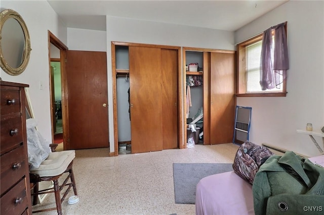 797 Hicks Rd, Warren, NY 13407 - bedroom featuring two closets and baseboard heating