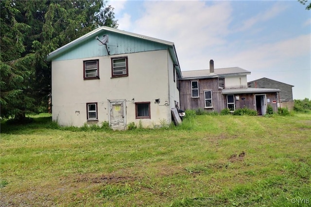 797 Hicks Rd, Warren, NY 13407 - rear view of property featuring a yard