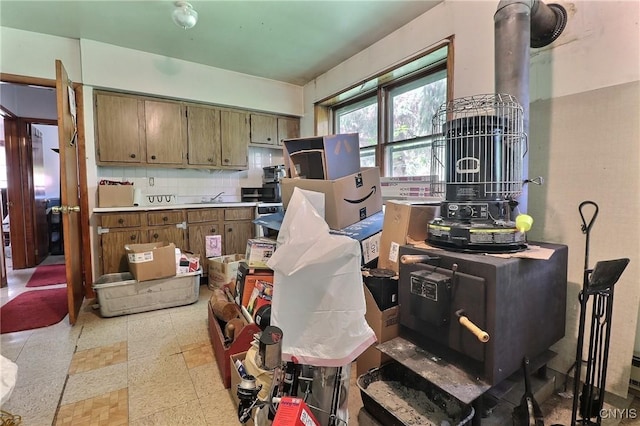 797 Hicks Rd, Warren, NY 13407 - kitchen with tasteful backsplash, brown cabinets, and light countertops
