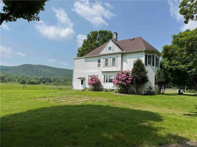 1902 E River Rd, Olean-Town, NY 14760 - back of house featuring a chimney, a yard, and a mountain view