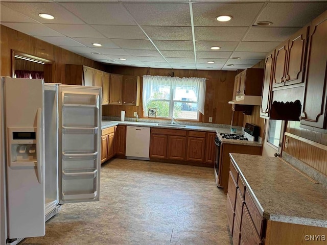 1902 E River Rd, Olean-Town, NY 14760 - kitchen featuring white appliances, under cabinet range hood, brown cabinetry, light countertops, and recessed lighting