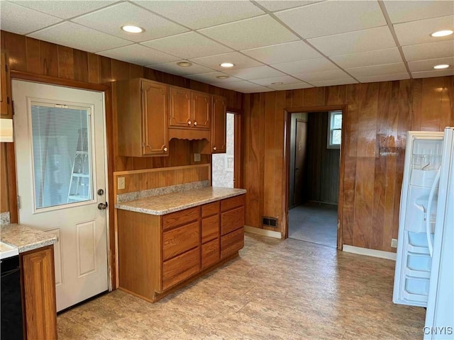 1902 E River Rd, Olean-Town, NY 14760 - kitchen featuring wood walls, light countertops, recessed lighting, brown cabinets, and light floors