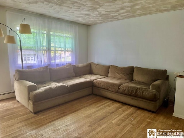 46 Pardee Ave, Jamestown, NY 14701 - living room with light wood finished floors and baseboard heating