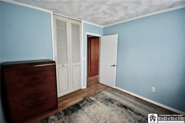46 Pardee Ave, Jamestown, NY 14701 - unfurnished bedroom with wood finished floors, a closet, and ornamental molding