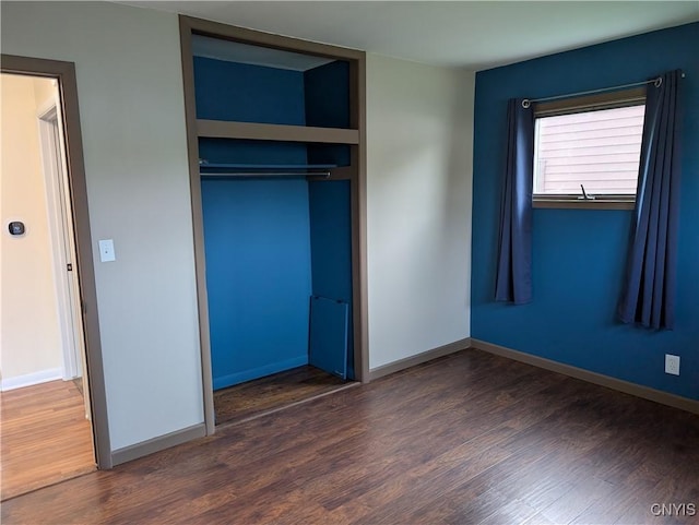 6 Cotty Dr, Dewitt, NY 13057 - unfurnished bedroom featuring wood finished floors and a closet