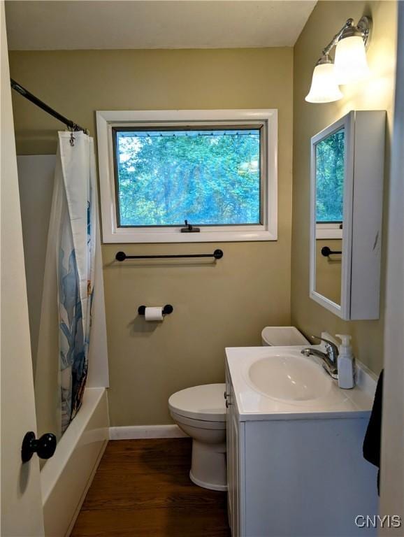 6 Cotty Dr, Dewitt, NY 13057 - bathroom featuring wood finished floors, vanity, and shower / tub combo with curtain