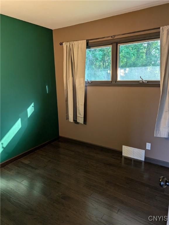 6 Cotty Dr, Dewitt, NY 13057 - unfurnished room with plenty of natural light and dark wood-type flooring