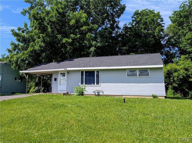 6 Cotty Dr, Dewitt, NY 13057 - ranch-style house featuring a front yard and an attached carport