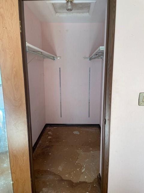 824 Franklin St, Skaneateles, NY 13152 - walk in closet featuring attic access