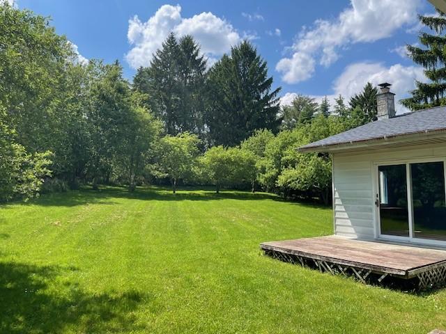 824 Franklin St, Skaneateles, NY 13152 - view of grassy yard with a wooden deck